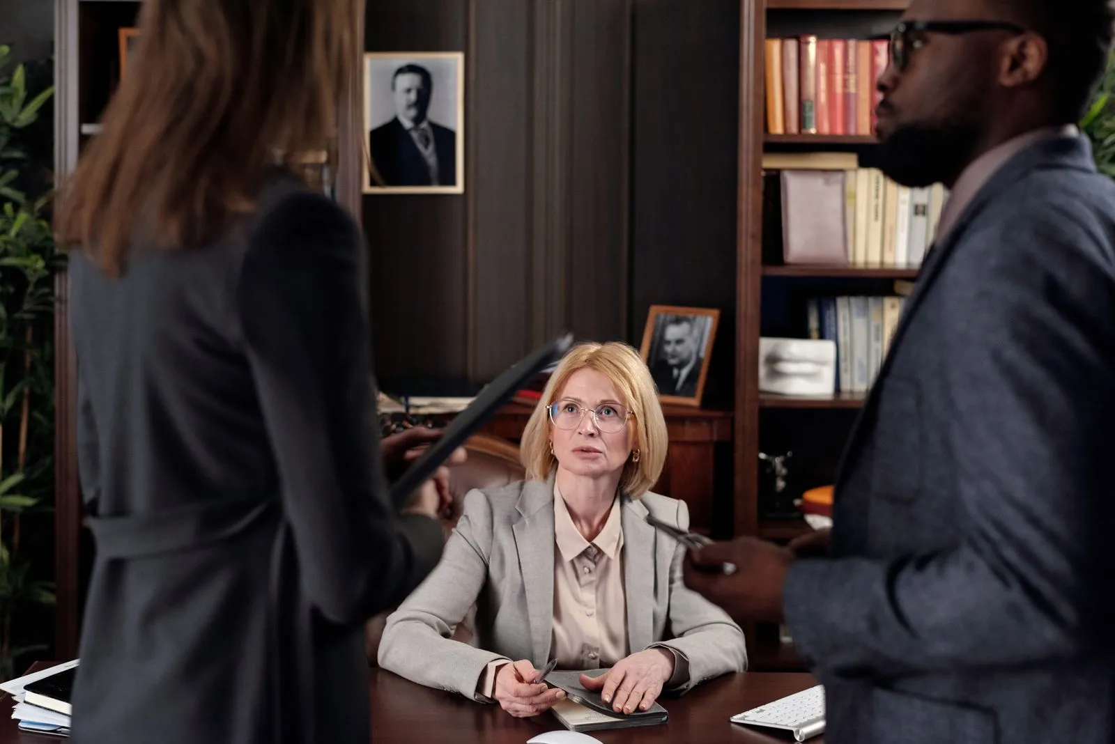 Diverse team discussing strategies in a professional office setting.